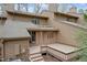 A multi-level wooden deck with stairs enhances the exterior of this cozy home at 58 Stoneridge Rd, Durham, NC 27705