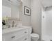 Clean bathroom featuring a marble vanity, modern mirror, and walk-in shower at 58 Stoneridge Rd, Durham, NC 27705