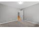 Neutral bedroom featuring new plush carpet, neutral wall paint, and a ceiling light fixture at 58 Stoneridge Rd, Durham, NC 27705