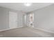 This bedroom features two closets, neutral walls and carpeting, and access to a bathroom at 58 Stoneridge Rd, Durham, NC 27705