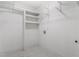 A walk-in closet with white wire shelving and a tile floor at 58 Stoneridge Rd, Durham, NC 27705