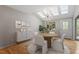 Bright dining room with skylights, hardwood floors, and a modern chandelier at 58 Stoneridge Rd, Durham, NC 27705