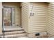 Close up of a home entrance with brick steps leading to a glass door at 58 Stoneridge Rd, Durham, NC 27705