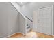 Bright foyer featuring hardwood floors, stairs, and a door with window panels at 58 Stoneridge Rd, Durham, NC 27705