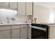 Updated kitchen with light gray cabinets, white countertops, and modern appliances at 58 Stoneridge Rd, Durham, NC 27705