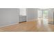 Living room view highlighting the beautiful hardwood floors and open kitchen space at 58 Stoneridge Rd, Durham, NC 27705