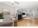Cozy living room featuring a fireplace, hardwood floors, and a sitting area with plush chairs at 58 Stoneridge Rd, Durham, NC 27705