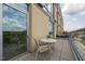 Relaxing balcony with comfortable seating and scenic neighborhood views at 601 W Rosemary St # 418, Chapel Hill, NC 27516