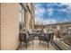 Balcony overlooking the town, furnished with a comfortable seating area, perfect for relaxing or entertaining at 601 W Rosemary St # 418, Chapel Hill, NC 27516