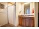 Well-lit bathroom showcases a wood vanity, granite countertop, and a shower with a curtain at 601 W Rosemary St # 418, Chapel Hill, NC 27516