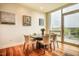 Elegant dining area featuring a marble table, stylish chairs, and a large window at 601 W Rosemary St # 418, Chapel Hill, NC 27516