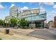 Modern building exterior with glass facade, street view, and attractive landscaping at 601 W Rosemary St # 418, Chapel Hill, NC 27516