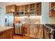 Close up of modern kitchen with granite countertops, stainless steel appliances, and wooden cabinets at 601 W Rosemary St # 418, Chapel Hill, NC 27516