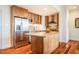 Well-equipped kitchen featuring stainless steel appliances, stylish wood cabinets, and a granite island at 601 W Rosemary St # 418, Chapel Hill, NC 27516