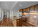 Modern kitchen with a large island, stainless steel appliances, and wooden cabinets at 601 W Rosemary St # 418, Chapel Hill, NC 27516