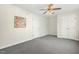 Bright bedroom features neutral walls, plush gray carpet, and a classic ceiling fan at 605 Lakeview Ave, Wake Forest, NC 27587