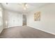 Bedroom featuring neutral walls, carpeted floors, a ceiling fan, and a double closet at 605 Lakeview Ave, Wake Forest, NC 27587
