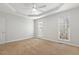 Bright bedroom featuring neutral walls, carpeted floors, a ceiling fan, and large windows at 605 Lakeview Ave, Wake Forest, NC 27587