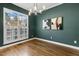 Formal dining room featuring hardwood floors, modern lighting, elegant decor, and large window with great views at 605 Lakeview Ave, Wake Forest, NC 27587