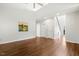 Spacious living area with soaring ceilings, hardwood floors, and a view of the staircase at 605 Lakeview Ave, Wake Forest, NC 27587