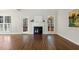 Bright living room with hardwood floors, a fireplace, and windows that let in plenty of natural light at 605 Lakeview Ave, Wake Forest, NC 27587