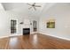Spacious living room featuring vaulted ceilings, hardwood floors, a fireplace, and natural light from windows at 605 Lakeview Ave, Wake Forest, NC 27587