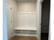 Entryway with convenient storage bench, hooks, and cubbies to keep organized at 609 Callan View Ave, Wake Forest, NC 27587