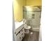Bathroom with a modern tiled shower featuring decorative accents, and a vanity at 6705 Somerknoll Dr, Durham, NC 27713