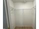 Walk-in closet with metal shelving and neutral walls at 6705 Somerknoll Dr, Durham, NC 27713