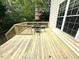 Wooden deck with a seating area, perfect for outdoor dining and relaxation at 6705 Somerknoll Dr, Durham, NC 27713