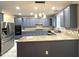 Spacious kitchen features granite countertops, stainless steel appliances and painted cabinets at 6705 Somerknoll Dr, Durham, NC 27713