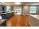 View of kitchen showing granite countertops, painted cabinets, and stainless steel appliances at 6705 Somerknoll Dr, Durham, NC 27713