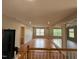 Bright living room with wood floors, recessed lighting, and expansive mirror at 6705 Somerknoll Dr, Durham, NC 27713