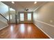 Bright living room with hardwood floors, crown molding, and entry door at 6705 Somerknoll Dr, Durham, NC 27713