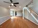 Living room with hardwood floors and staircase at 6705 Somerknoll Dr, Durham, NC 27713