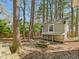 Backyard with chicken coop and stacked stone fire pit at 7117 Sandringham Dr, Raleigh, NC 27613