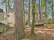 Backyard with deck and trees at 7117 Sandringham Dr, Raleigh, NC 27613
