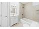 Cozy bathroom with a vanity, shower-tub combo, and neutral color palette at 7117 Sandringham Dr, Raleigh, NC 27613
