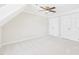 Well-lit bedroom boasts plush carpeting, neutral paint, white trim, and dual closets for ample storage at 7117 Sandringham Dr, Raleigh, NC 27613