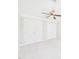 Bright bedroom with white walls, carpet, ceiling fan, and closet doors at 7117 Sandringham Dr, Raleigh, NC 27613
