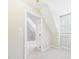 Bright bedroom showcases a sloped ceiling, neutral carpet and access to plenty of natural light at 7117 Sandringham Dr, Raleigh, NC 27613