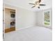 Bright bedroom with ceiling fan, carpet, and a window for plenty of natural light at 7117 Sandringham Dr, Raleigh, NC 27613