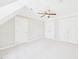 Spacious bedroom featuring white walls, plush carpeting, and ample closet space at 7117 Sandringham Dr, Raleigh, NC 27613