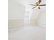 Cozy carpeted bedroom showcases a sloped ceiling, a window, and neutral-colored walls, providing a relaxing space at 7117 Sandringham Dr, Raleigh, NC 27613
