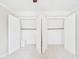 Open double closet showing shelves and rods for maximum storage at 7117 Sandringham Dr, Raleigh, NC 27613