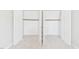 Spacious walk-in closets offer ample storage, featuring rod and shelf systems with a small access door at 7117 Sandringham Dr, Raleigh, NC 27613