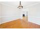 Charming dining room features hardwood floors and is perfect for entertaining guests at 7117 Sandringham Dr, Raleigh, NC 27613