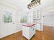 Bright kitchen offers island, white cabinets, and a window for natural light at 7117 Sandringham Dr, Raleigh, NC 27613