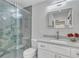Modern bathroom with a glass-enclosed shower, stylish tile work, and a vanity at 717 E Millbrook Rd, Raleigh, NC 27609