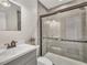 Bathroom features a shower and modern vanity at 717 E Millbrook Rd, Raleigh, NC 27609